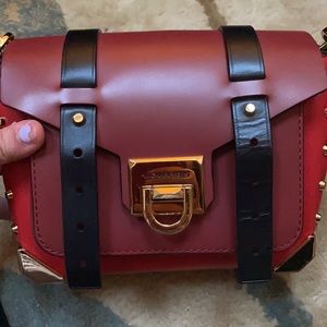 red black and gold studded michael kors crossbody